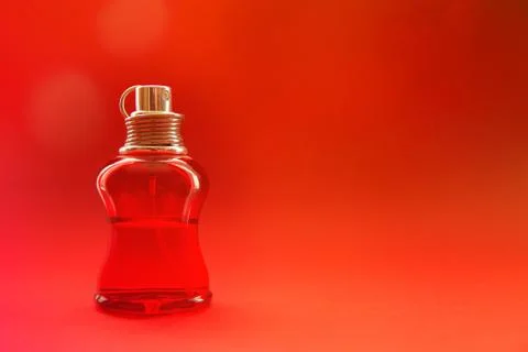 Red bottle with liquid on red background with copy space Stock Photos