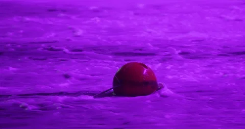 Red Bouy In Rapid River That's Lit Up In Purple Lights In Dubai Stock Footage 119849048