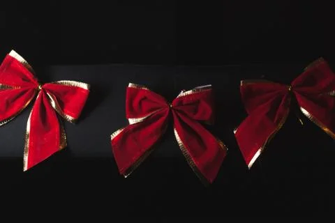Red bow on a black background, Stock-Fotos