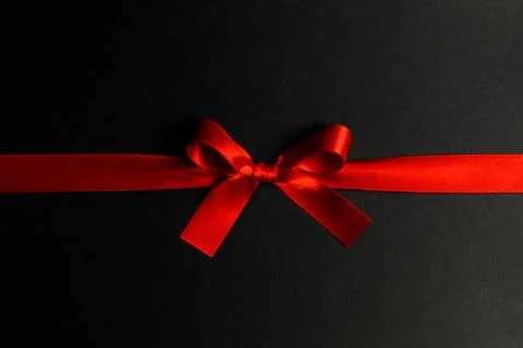 Red bow on black Foto stock