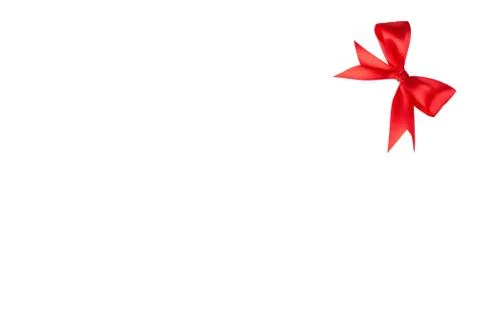 Red bow in the corner on the white background Stock Photos