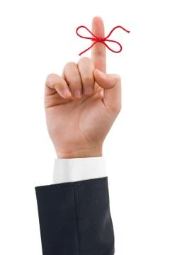 Red bow on finger Stock Photos