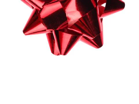 Red bow isolated on white background. A holiday symbol, an element of decor. Photos