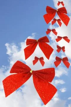 Red bow ribbons in the sky Stock Illustration