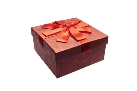 Red box with a bow with a gift isolated on white background Stock Photos