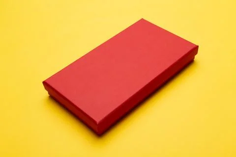 Red box product packaging isolated on yellow background Stock Photos