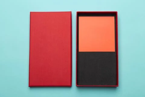 Red box product packaging isolated on blue background Stock Photos