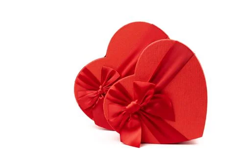 Red box in shape of heart. Gift box for Valentine's Day. Isolated on white ba Stock Photos