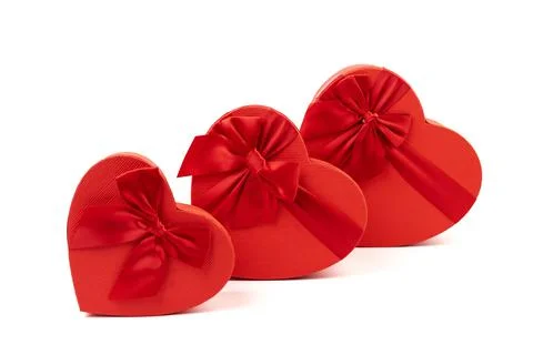 Red box in shape of heart. Gift box for Valentine's Day. Isolated on white ba Stock Photos
