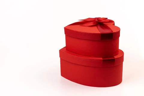 Red box in shape of heart. Gift box for Valentine's Day. Isolated on white ba Stock Photos