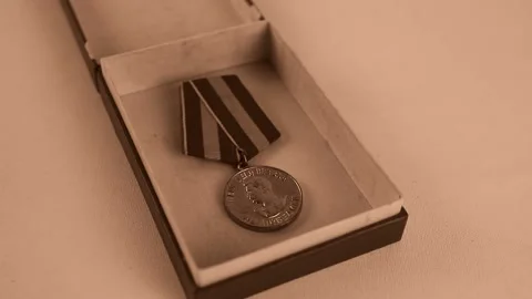 Red box with Soviet  Medal with image Josef Stalin Stock Footage 146711082