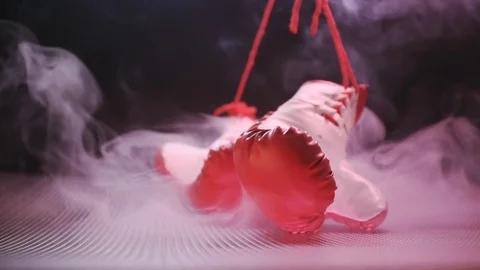 Red Boxing Gloves Falling On The Abstract Surface. Video stock 124452561