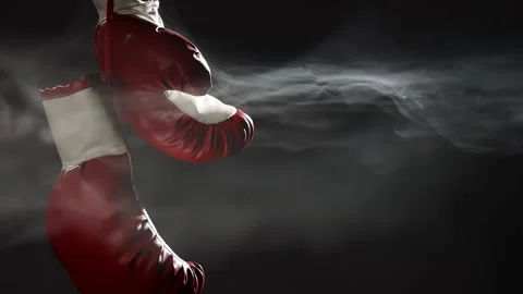 Red Boxing Gloves hang in surrounded by smoke. Stock-Footage 166605149