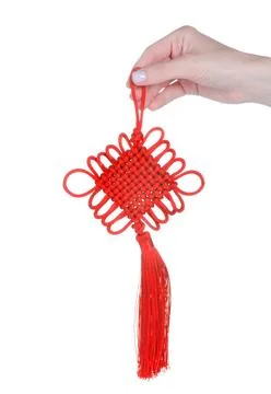 Red braided amulet in hand Stock Photos