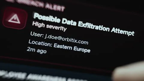 Red breach alert reports a possible data exfiltration attempt for user Stock Photos