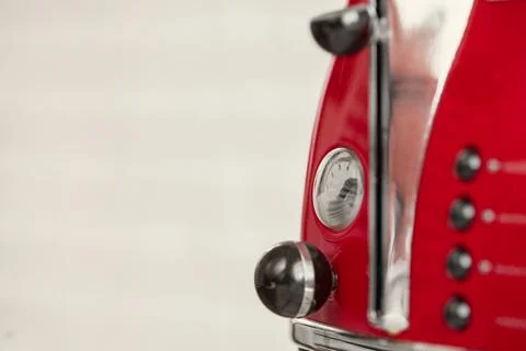 Red bread toaster close up in kitchen Stock Photos