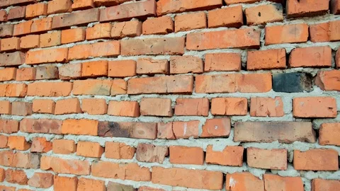 Red brick and stone wall with damaged old brick, background for design Stock-Footage 115694163