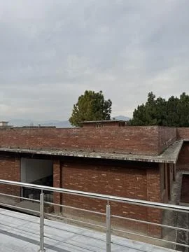 Red Brick Architecture Under Overcast Sky 스톡 사진