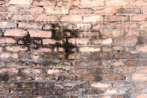 Red brick background: closeup of an old uneven brick wall. Stock Photos