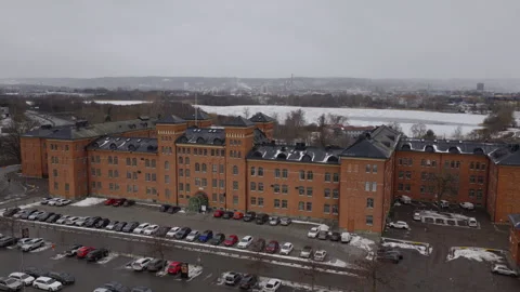 Red brick barracks building with snowy courtyard Jonkoping Sweden aerial view Vídeo Stock 330779393