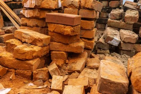 Red brick block Stacked bricks rough material build construction Stockfoto's