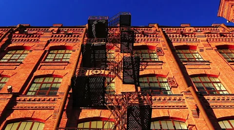 Red brick building with fire escape Видео 37460903