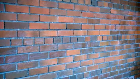 A red brick building wall extending into the future. architecture background, Stock Photos