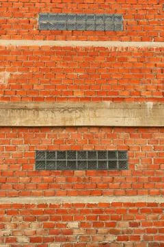 Red brick with cement wall under construction architecture background Stock Photos