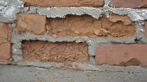 Red Brick Crumbles In The Wall. The Facing Brick Crumbles Video stock 149684610