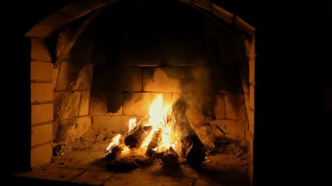 Red brick fireplace with burning fire Video stock 115900192