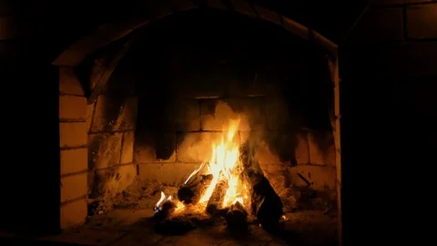 Red brick fireplace with burning fire Stock Footage 115901487