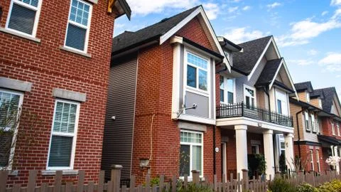 Red brick homes side by side. Row of Typical English Terraced Houses, townhom Stock Photos