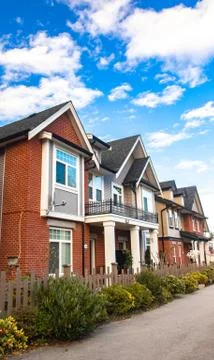 Red brick homes side by side. Row of Typical English Terraced Houses, townhom Stock Photos