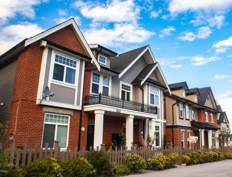 Red brick homes side by side. Row of Typical English Terraced Houses, townhom Stock Photos