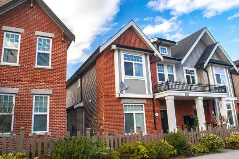Red brick homes side by side. Row of Typical English Terraced Houses, townhom Stock Photos