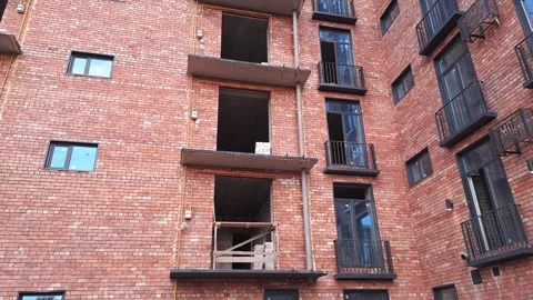 Red brick house under construction left to right overview Stock Footage 289543198