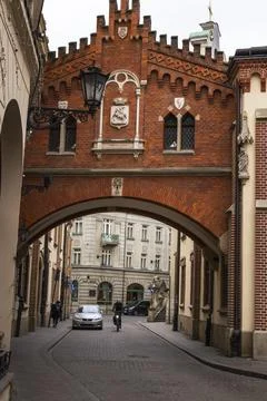 Red brick Neo-Gothic gate archway Old Town Kraków Poland street view Stock Photos
