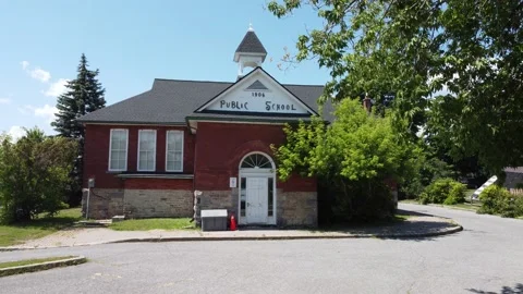 Red brick old school 1906 aerial 4K zoom in Stock Footage 201435958