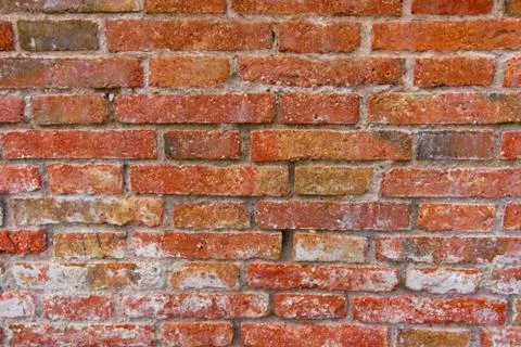 Red brick pattern. Old brick wall with cracks and scratches. Horizontal backg Foto stock