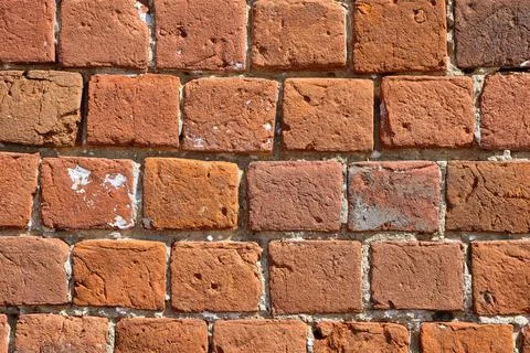 Red brick pattern. An old brick wall with cracks and scratches. A wall with the Stock Photos