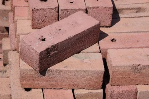 Red brick on a pile Stock Photos