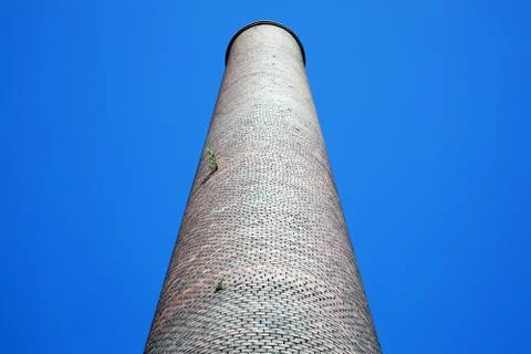 Red brick smoke stack industrial chimney Stock Photos