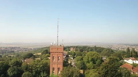 Red brick square tower between trees in park Stock-Footage 160997946