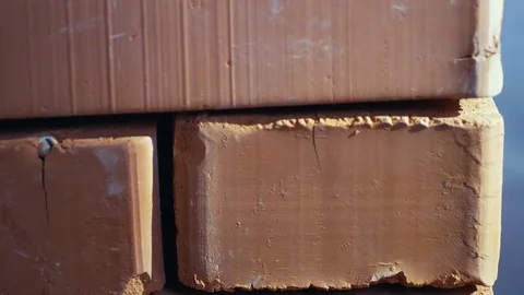 Red brick stack near wall Stockbeeldmateriaal 74126889