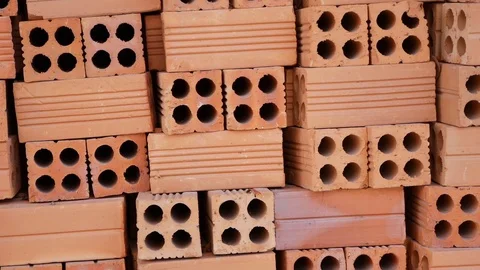 Red brick stack at outside on construction site. Video stock 114267261