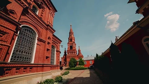 The red brick temple stands against the blue sky Stock Footage 303842008