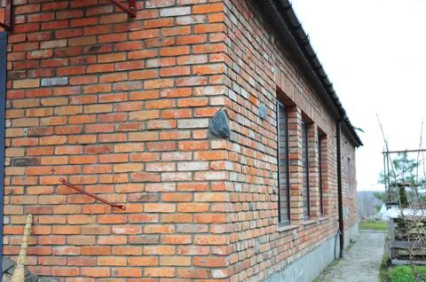 Red brick texture of the corner of the house. Red Brick wall for background o Stock Photos