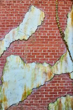 Red brick texture with white plaster patches decaying Stock Photos