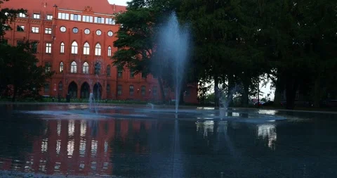 Red Brick Town Hall and Fountain at Jasne Błonia Square in Szczecin Poland Stock Footage 337330347