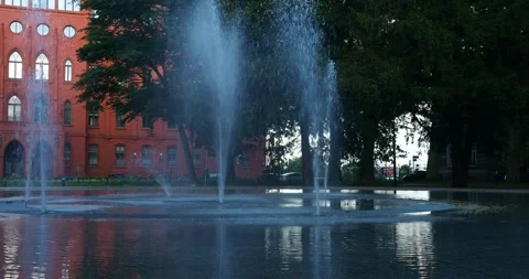 Red Brick Town Hall and Fountain at Jasne Błonia Square in Szczecin Poland Stock Footage 337419344